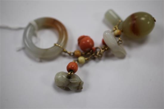 A collection of Chinese gold mounted jade and coral carvings and beads, Qing dynasty, total length 10.5cm